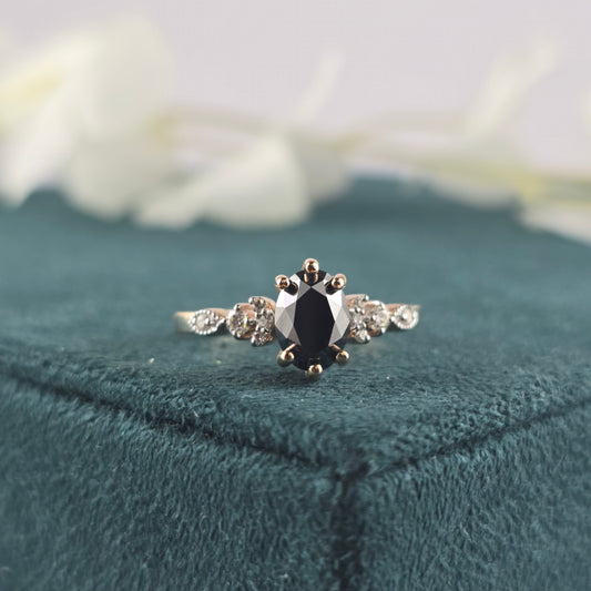 Rose Gold Black Diamond Ring – Oval Cut with White Stone Accents