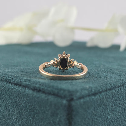 Rose Gold Black Diamond Ring – Oval Cut with White Stone Accents